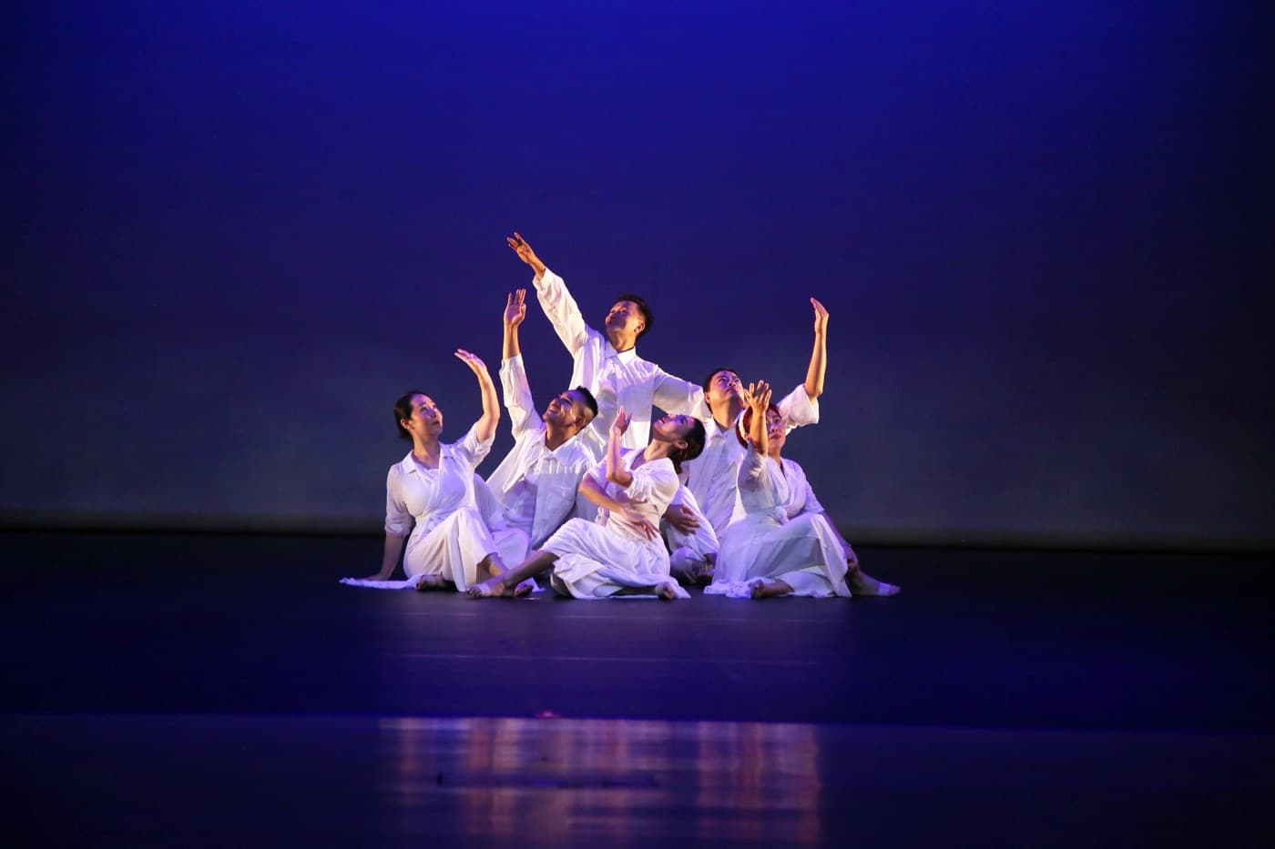Adult dancers exploring movement in a bright studio