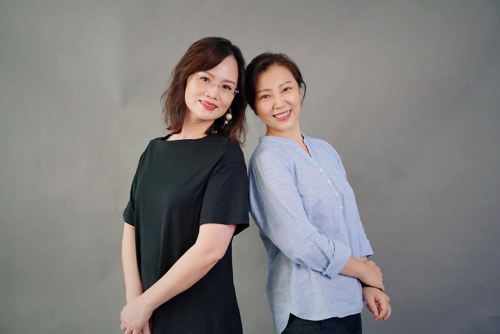 Adult dancers sharing a light moment together